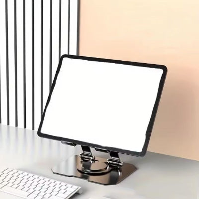 Porte tablette inclinable en métal sur un bureau moderne, offrant un support stable et ergonomique pour améliorer le confort de lecture et de travail.