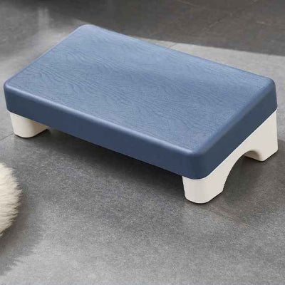 Repose pied ergonomique bleu sur le sol  en vue rapproché